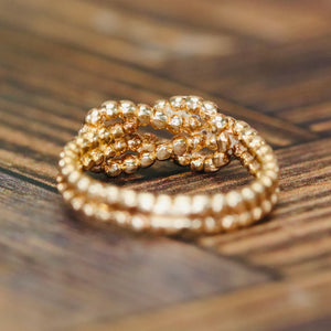 Lovers knot ring in 14k yellow gold