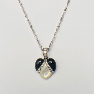 Onyx, mother of pearl and diamond pendant from Kabana